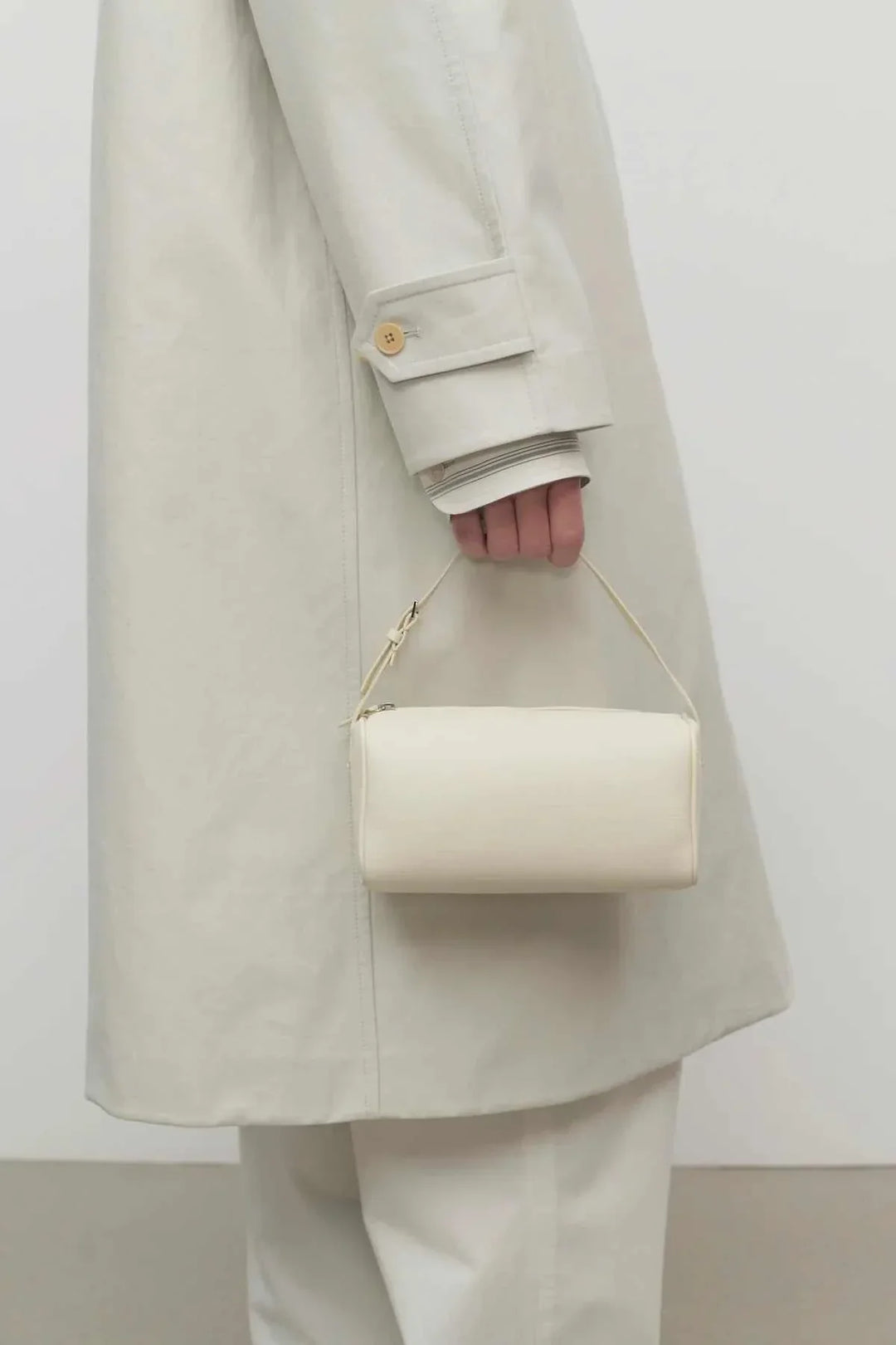 ivory mini structured handbag styled with neutral outfit