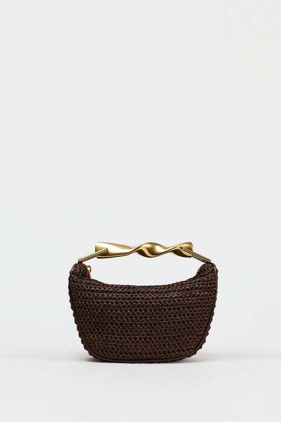 Ayla woven crossbody bag with sculptural gold-tone handle and compact silhouette