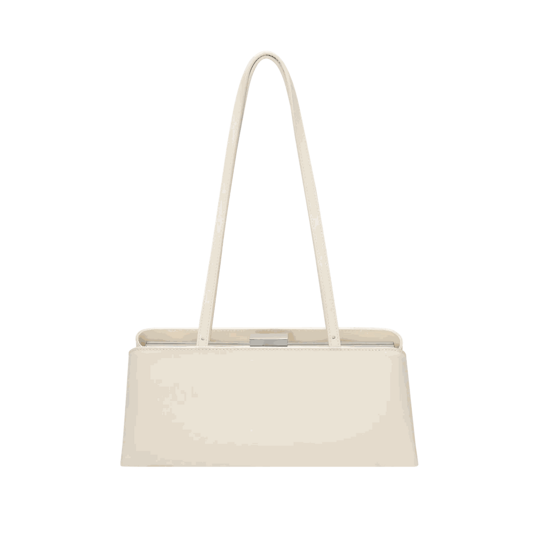Leclair beige handbag with sleek elongated silhouette and structured frame closure