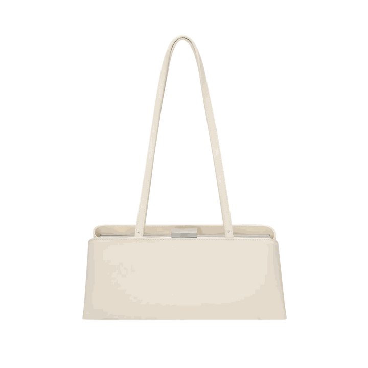 Leclair beige handbag with sleek elongated silhouette and structured frame closure