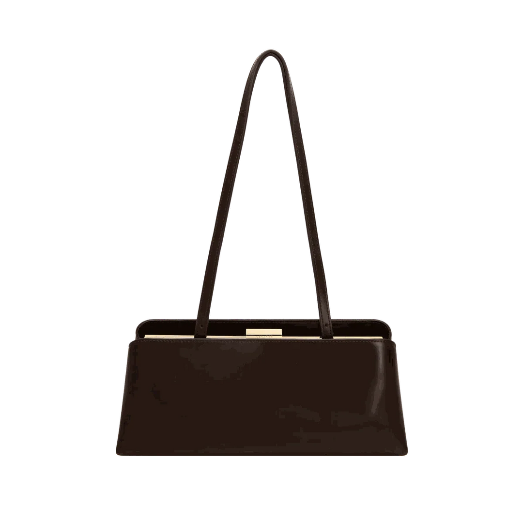 sleek black Leclair handbag with structured frame and long handles