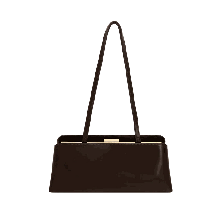 sleek black Leclair handbag with structured frame and long handles