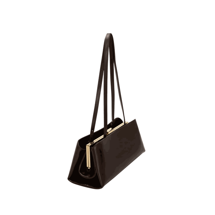 Leclair Handbag sleek black structured handbag with elongated silhouette and gold frame closure