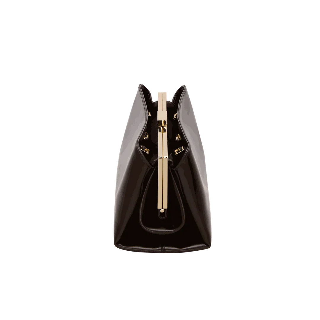 Sleek black Leclair handbag with structured frame and gold clasp, minimalist modern design