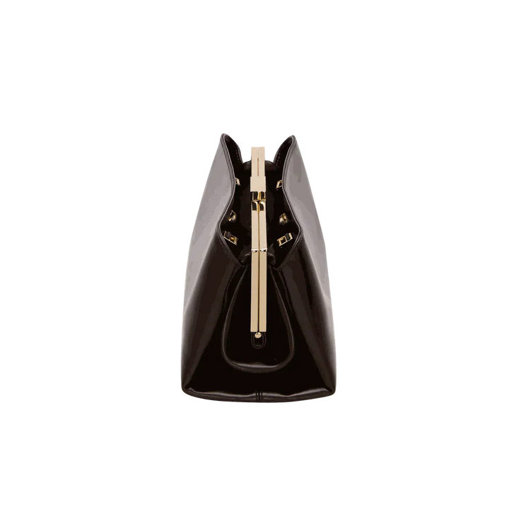 Sleek black Leclair handbag with structured frame and gold clasp, minimalist modern design