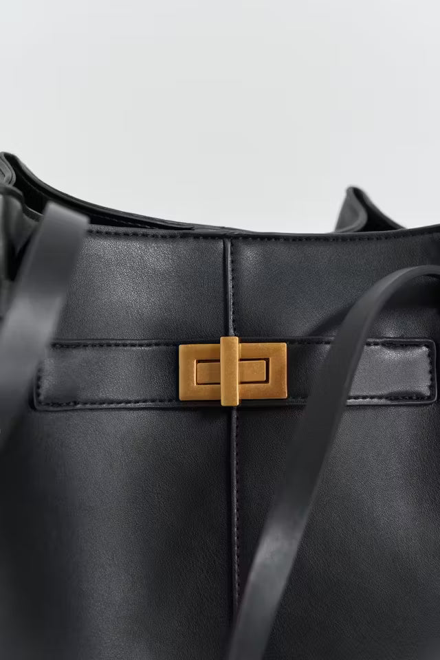 Black Delair Tote Bag in soft vegan leather with gold-tone clasp and minimalist design