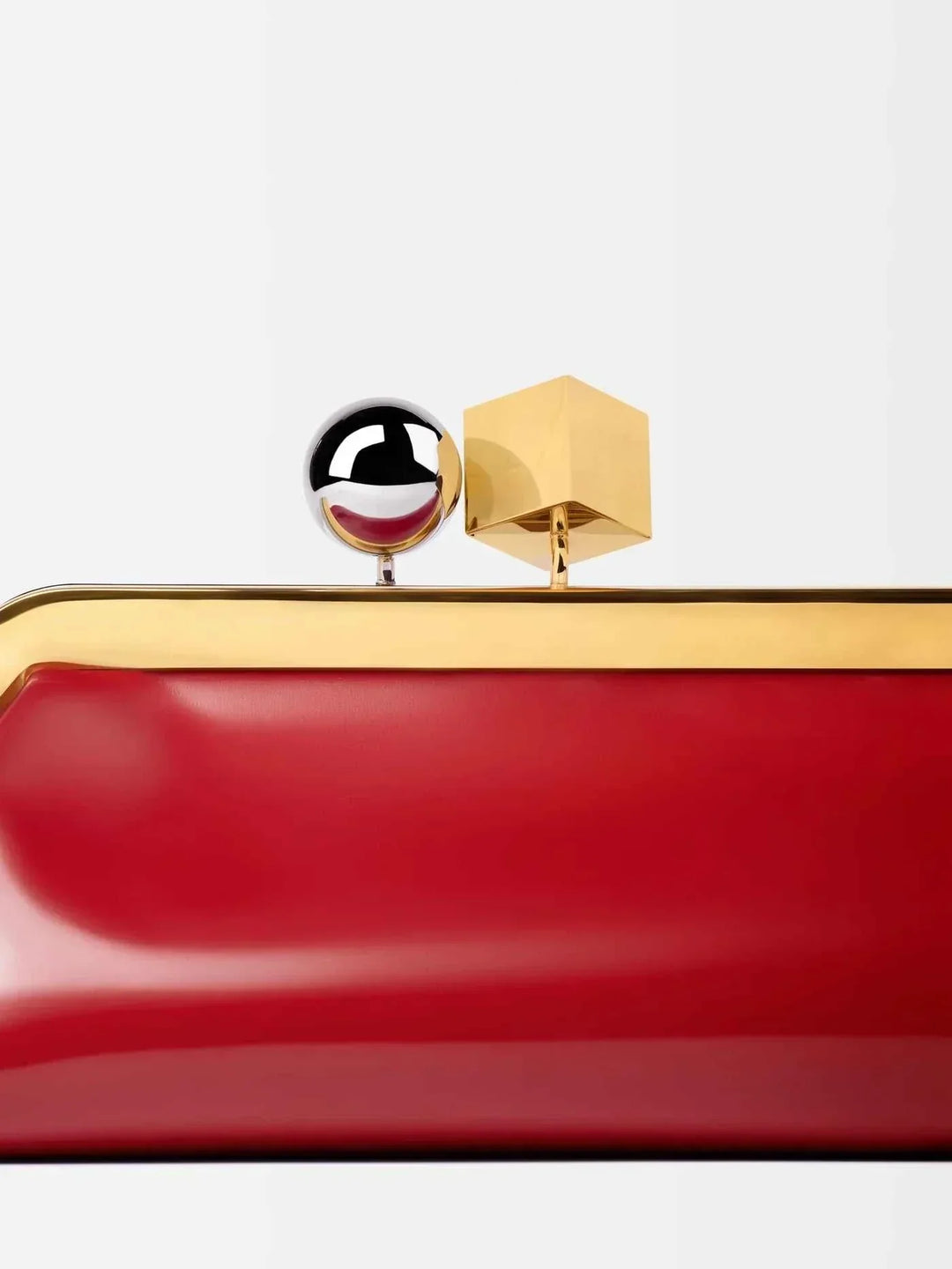 Red Venti clutch bag in smooth vegan leather with bold gold frame and dual-metal clasp detail