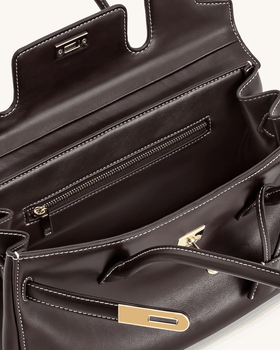 Interior view of Marisse shoulder bag with smooth black finish and gold zipper details