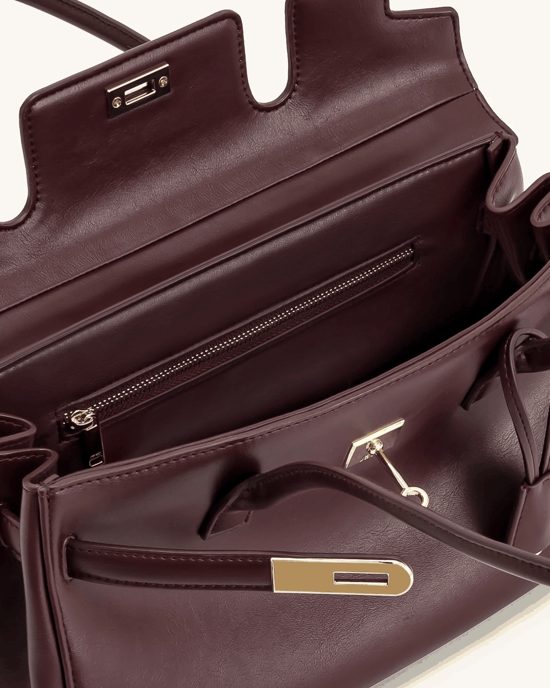 Marisse structured brown leather shoulder bag with gold hardware and zippered interior compartment