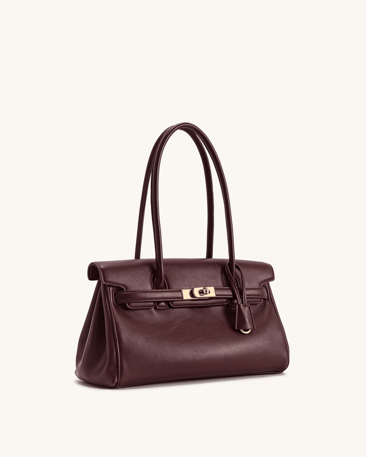 Marisse structured shoulder bag in smooth brown leather with subtle gold hardware and long handles for versatile carry.