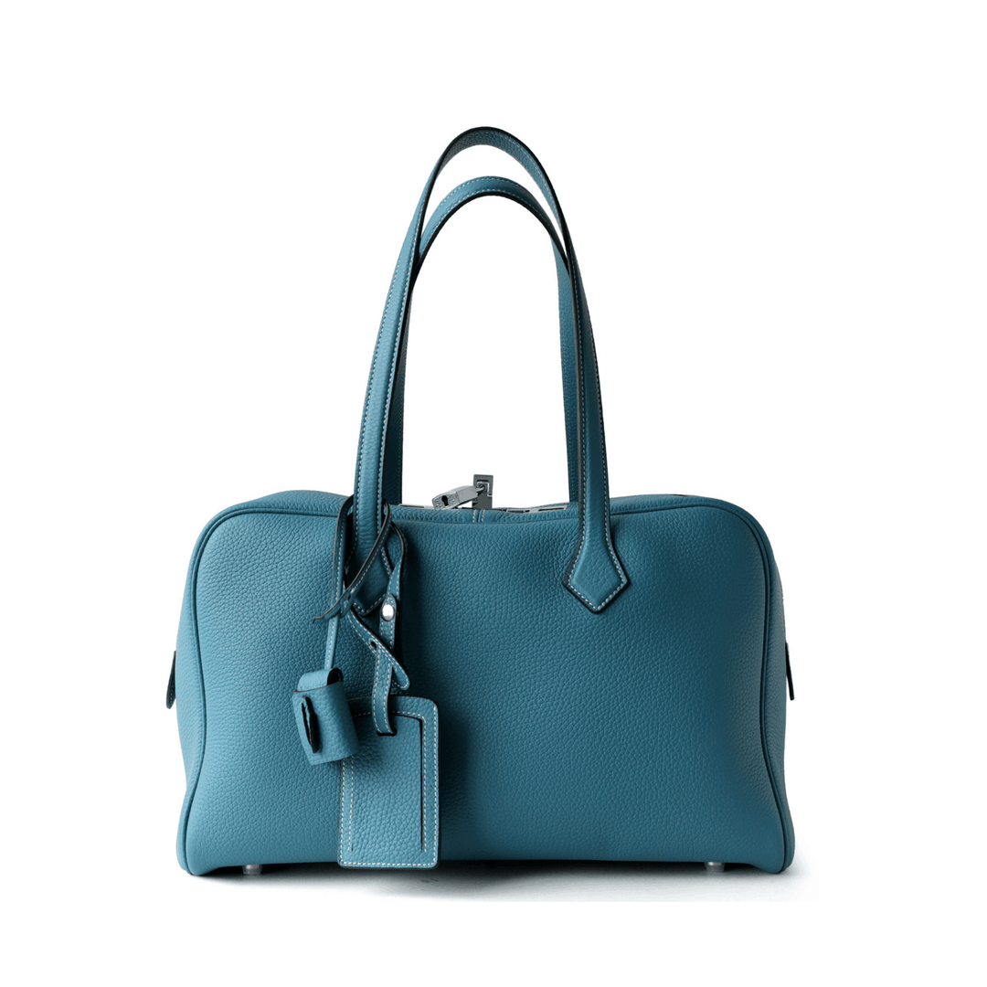 Elliot Shoulder Bag in premium vegan leather with zip-top closure and long handles, spacious for daily essentials.