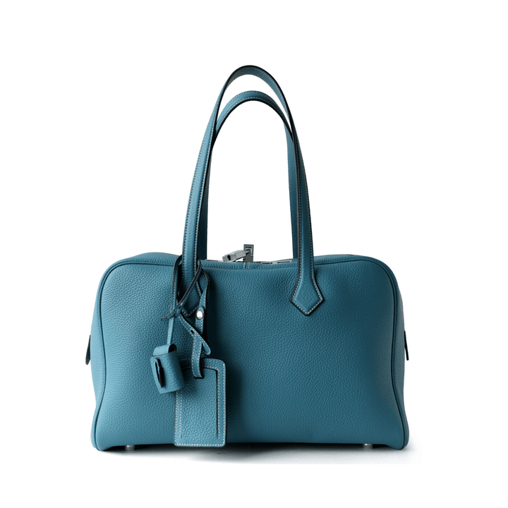 Elliot Shoulder Bag in premium vegan leather with zip-top closure and long handles, spacious for daily essentials.