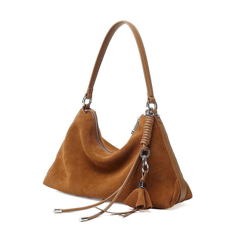 Cadence Hobo Bag in taupe genuine cowhide suede with braided detailing and tassel, spacious with dual straps for versatile everyday use