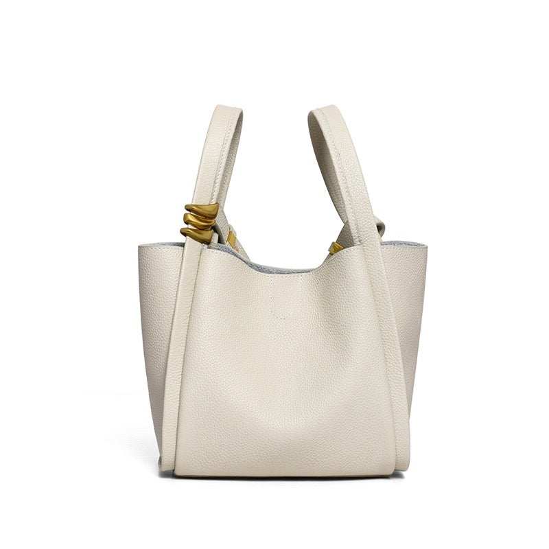 Solstice Bucket Crossbody vegan leather bag with structured silhouette and removable pouch in creamy white