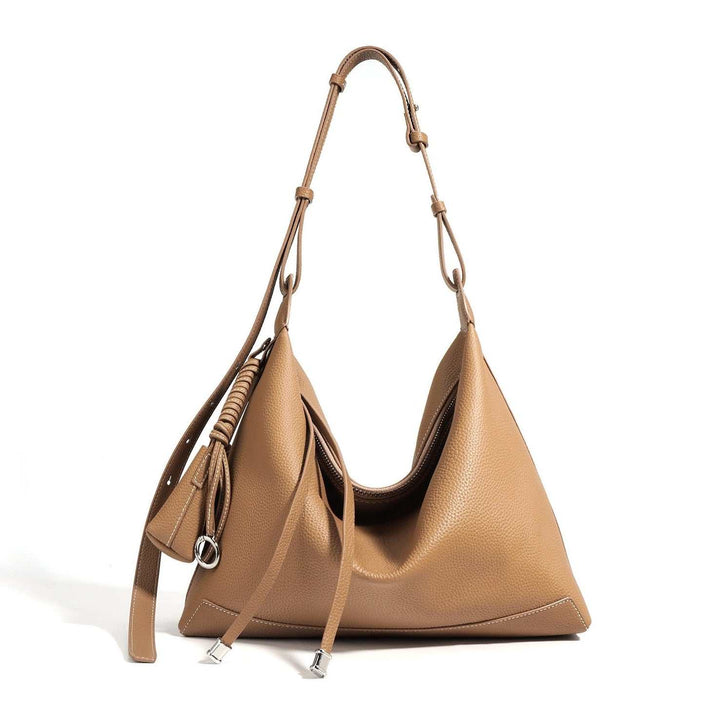 Crescent Slouch Tote vegan leather tote bag with shell-shaped silhouette and single strap in multiple colors