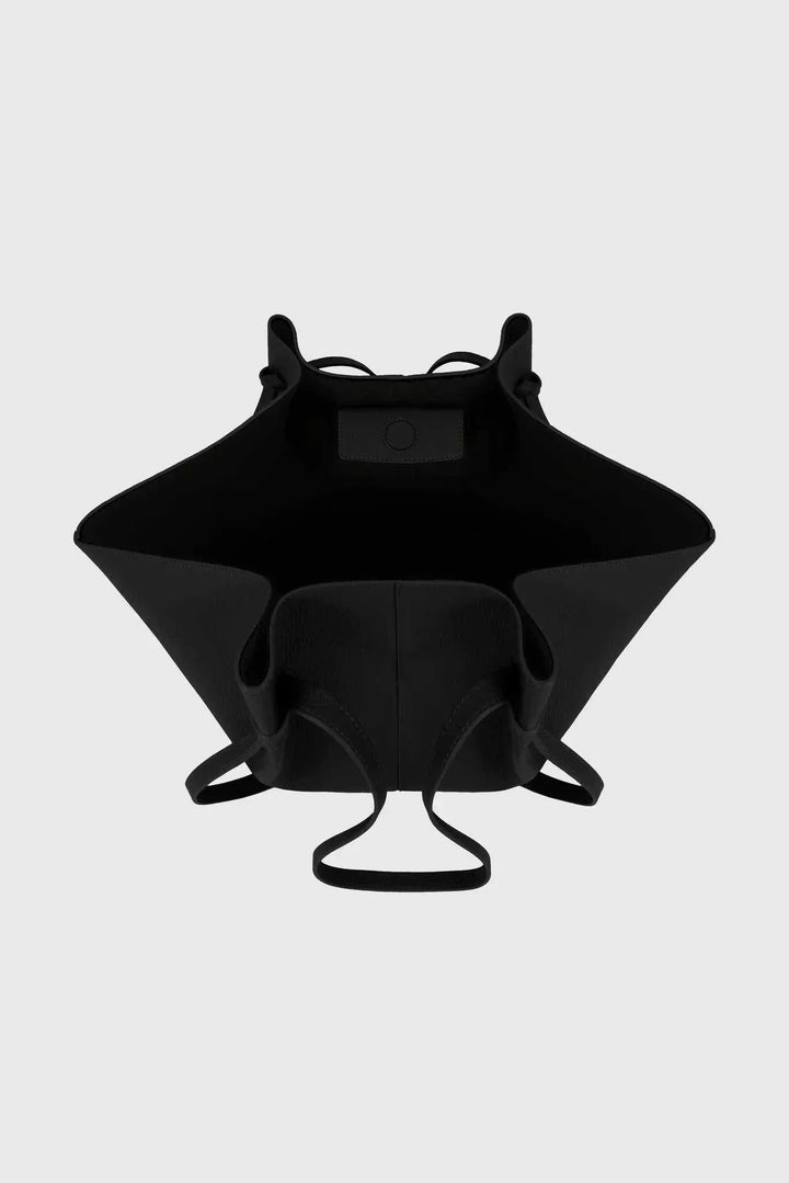 Black vegan leather Savina tote bag with spacious interior and knotted handles