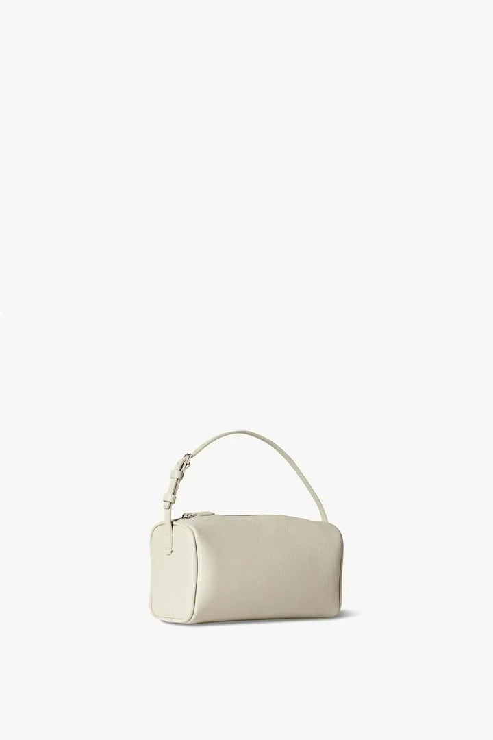 side view of ivory grain textured mini handbag