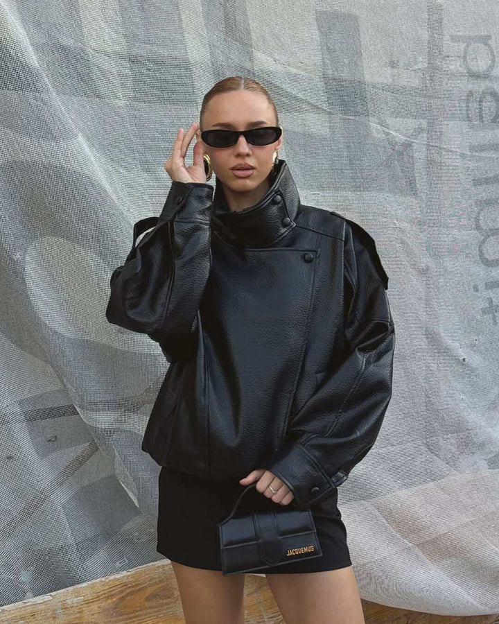 Oversized faux leather jacket with high funnel neck and sculpted sleeves in black
