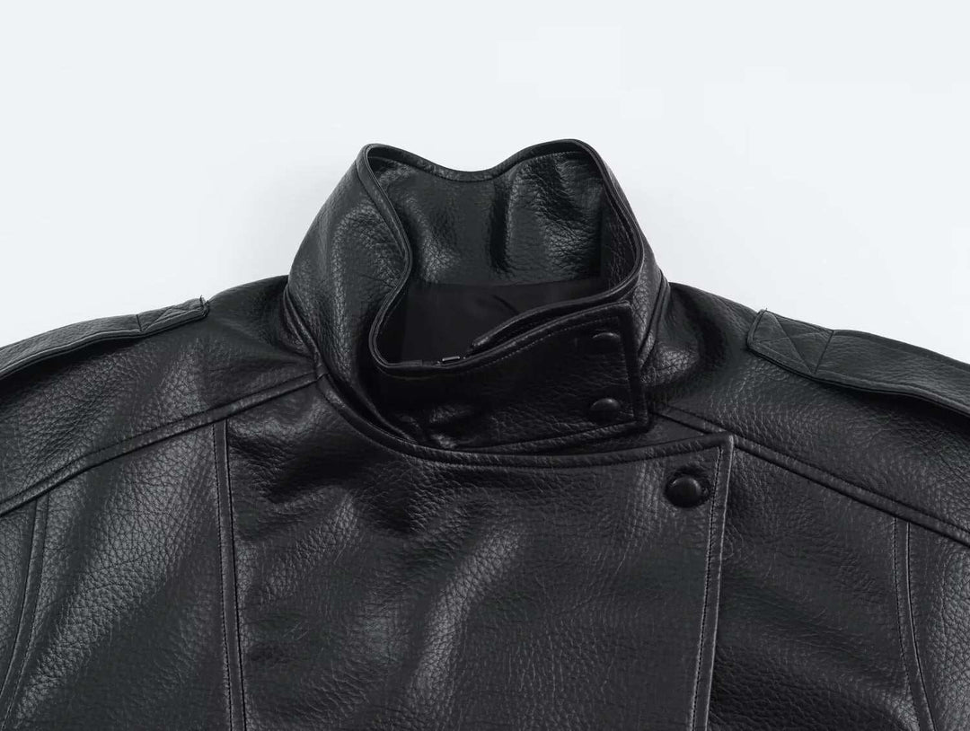 Black oversized faux leather jacket with high funnel neck and snap-button closure