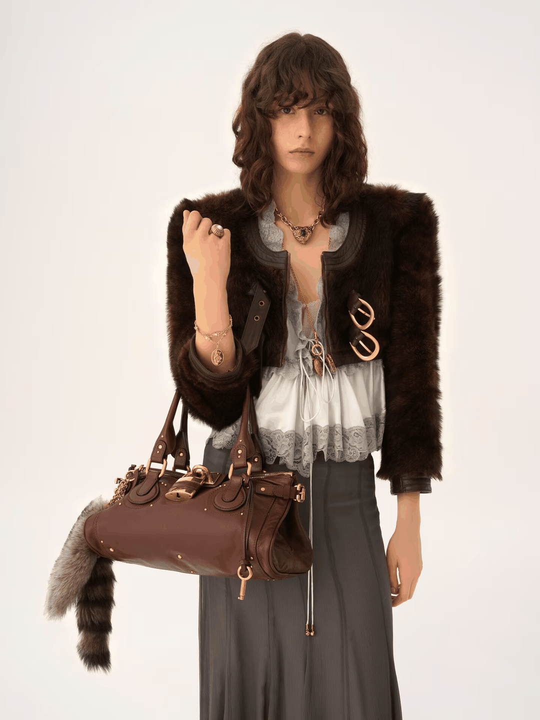 Stylish Marcelle Lock handbag with oversized gold lock and double handles in brown vegan leather